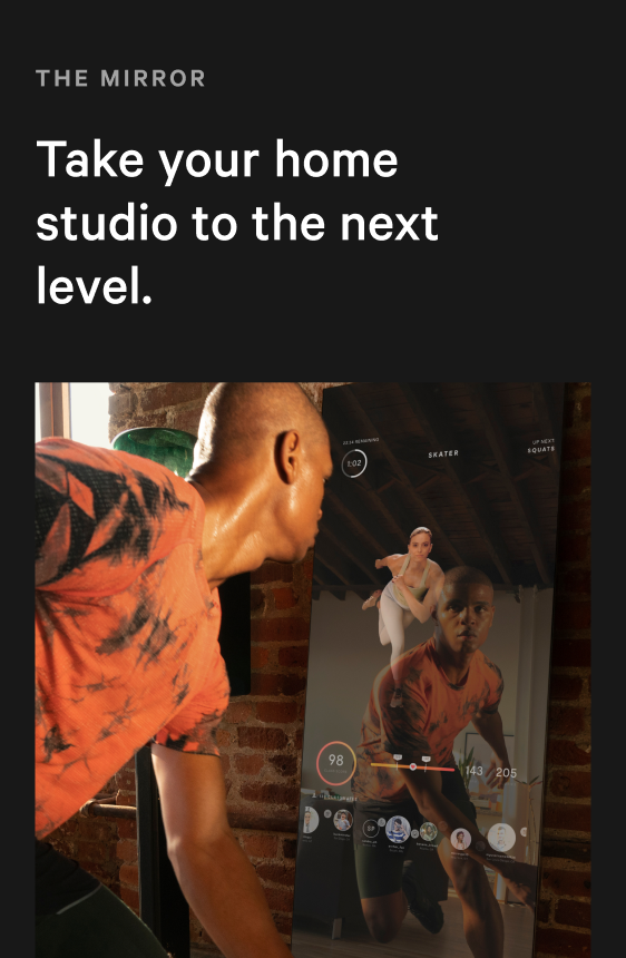 The Mirror — Take your home studio to the next level; member training with instructor and metrics on screen against brick wall